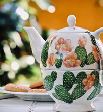 tea brewing in floral teapot 