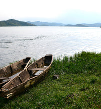 Two canoes on bank of Lake Kivi