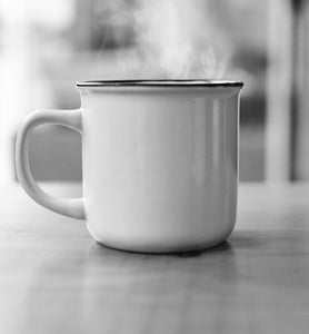 steaming coffee in a white porcelain coffee cup