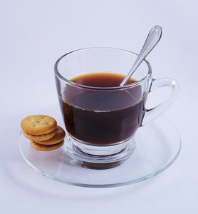 black coffee in clear glass coffee cup with spoon