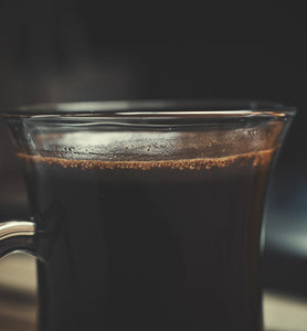 black coffee in a clear glass mug