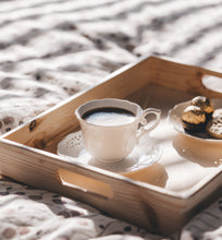 black coffee in white cup on breakfast tray