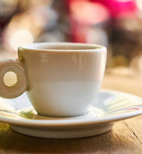 coffee in white mug on wooden table