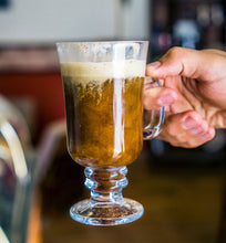 cup of Irish cream coffee in clear mug