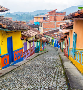 Colombian colorful colonial homes on cobblestone street 