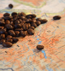 Ethiopian roasted coffee beans sit on map of Ethiopia