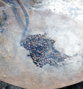 Ethiopian coffee is roasted during traditional coffee ceremony