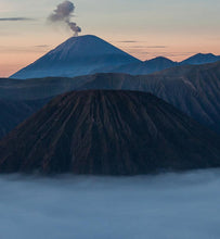 Sumatra volcanoes spewing ash at dusk