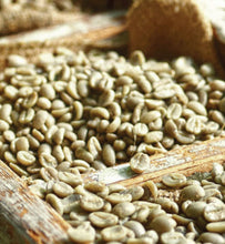 dried coffee beans stored in wooden container