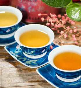 different types of brewed green teas in porcelain tea cups