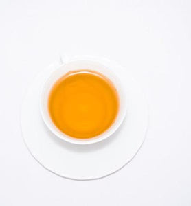 brewed white tea in white ceramic tea cup